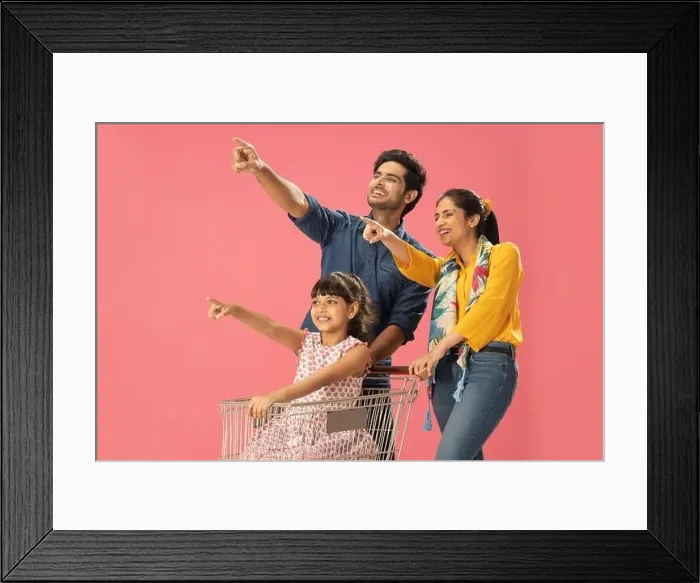 Framed Print : AN ENTHUSIASTIC FAMILY POINTING AWAY WHILE SHOPPING TOGETHER Framed Print : AN ENTHUSIASTIC FAMILY POINTING AWAY WHILE SHOPPING TOGETHER