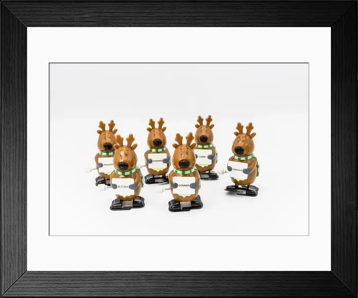 Framed Print : Group of six novelty plastic wind-up models of Santa's reindeer holding signs with their names Framed Print : Group of six novelty plastic wind-up models of Santa's reindeer holding signs with their names