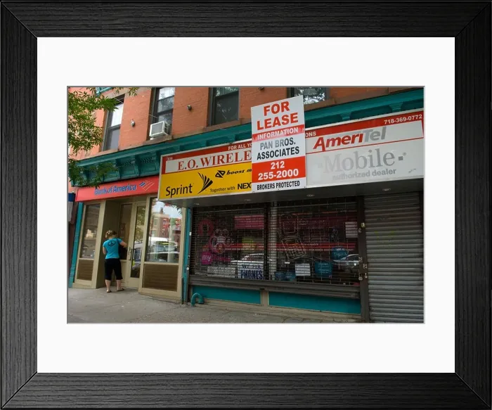 Framed Print : Cellphone store for lease in Park Slope Brooklyn New York on Saturday 13 2009 Frances M Roberts
