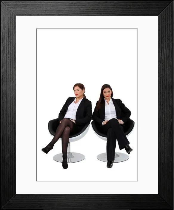 Framed Print : Businesswomen sitting side by side Framed Print : Businesswomen sitting side by side