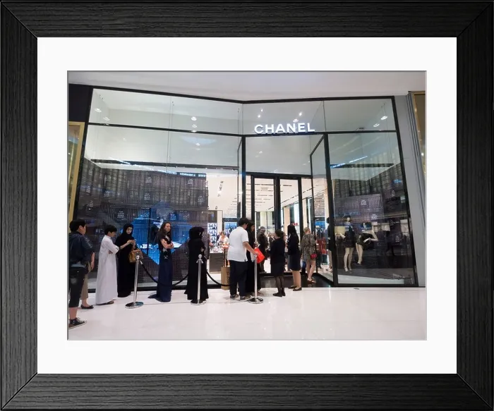 Framed Print : Queue of shoppers outside Chanel boutique at The Dubai Mall in Dubai United Arab Emirates Framed Print : Queue of shoppers outside Chanel boutique at The Dubai Mall in Dubai United Arab Emirates