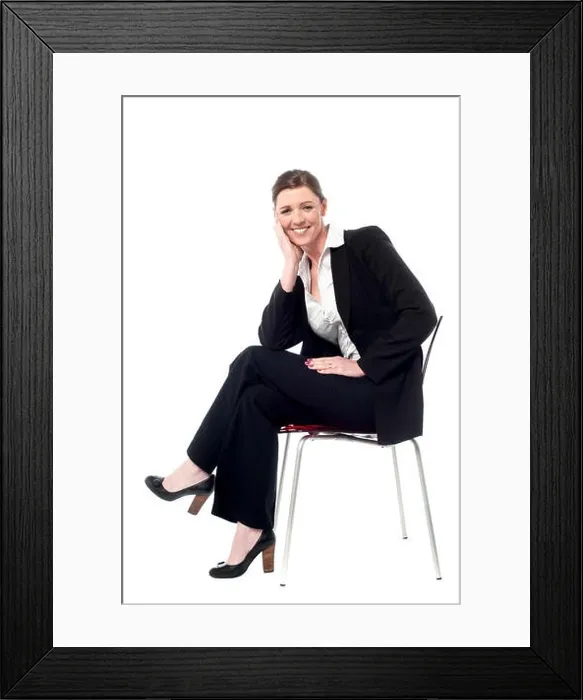 Framed Print : Isolated corporate woman sitting on the chair Framed Print : Isolated corporate woman sitting on the chair