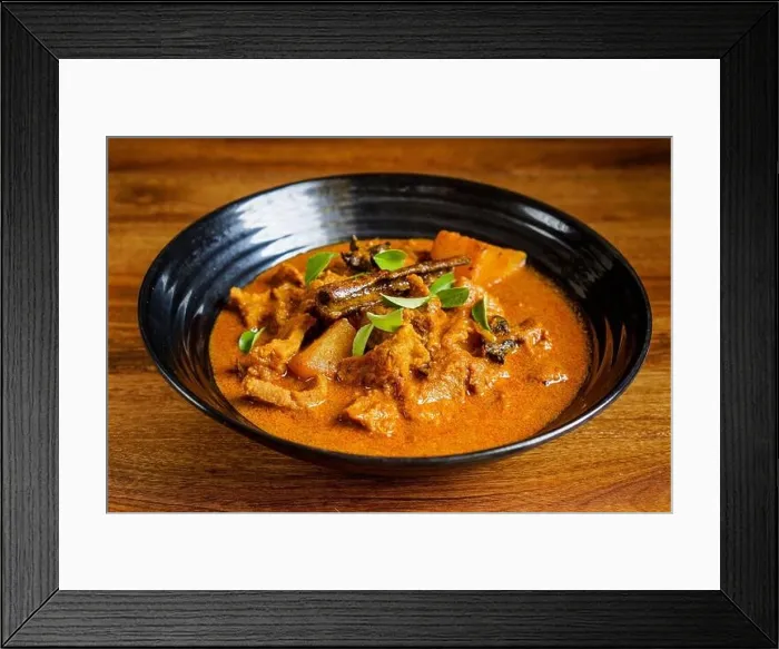Framed Print : Lamb meat cooked in thick curry with potatoes and spices and garnished with curry leaves Framed Print : Lamb meat cooked in thick curry with potatoes and spices and garnished with curry leaves