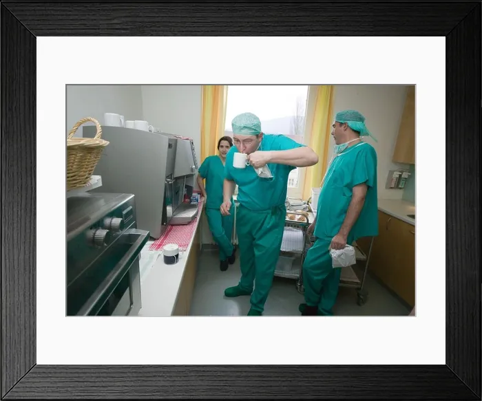 Framed Print : surgeons having early morning cup of coffee before entering operating room Framed Print : surgeons having early morning cup of coffee before entering operating room