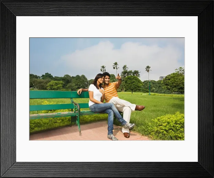 Framed Print : Couple sitting in a park, Kolkata, West Bengal, India Framed Print : Couple sitting in a park, Kolkata, West Bengal, India