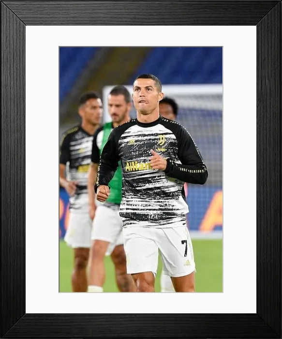 Framed Print : Cristiano Rolando of Juventus seen in action during the Italian Football Championship League A 2020 / 2021 match between AS Roma vs FC Juventus Framed Print : Cristiano Rolando of Juventus seen in action during the Italian Football Championship League A 2020 / 2021 match between AS Roma vs FC Juventus