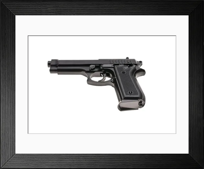 Framed Print : An isolated black pistol on a white background Framed Print : An isolated black pistol on a white background