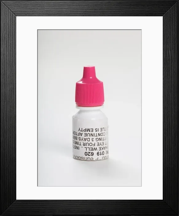 Framed Print : Pink cap eye drop bottle, antibiotic prescription medicine Framed Print : Pink cap eye drop bottle, antibiotic prescription medicine