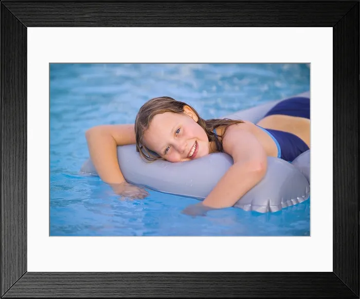 Framed Print : SPAIN IBIZA 10 YEAR OLD GIRL CHILD FEMALE LYING ON LILO INFLATABLE AIR MATTRESS IN SWIMMING POOL SMILING HAPPY FUN PLAY Framed Print : SPAIN IBIZA 10 YEAR OLD GIRL CHILD FEMALE LYING ON LILO INFLATABLE AIR MATTRESS IN SWIMMING POOL SMILING HAPPY FUN PLAY