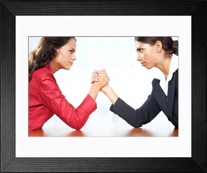 Framed Print : Profile of two women in struggle while their arms being wrestled Framed Print : Profile of two women in struggle while their arms being wrestled
