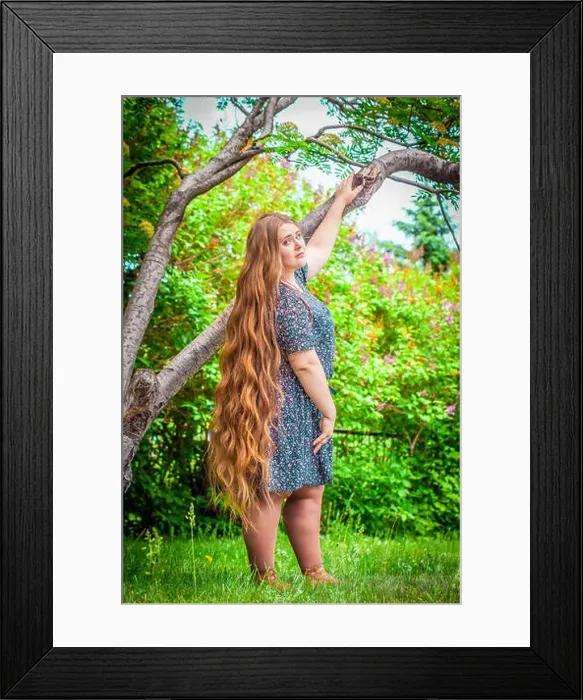 Framed Print : Beautiful plump girl with long hair. Plus size model posing against nature background Framed Print : Beautiful plump girl with long hair. Plus size model posing against nature background