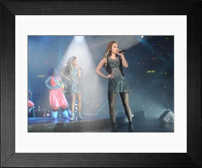 Framed Print : Gillian Chung, front, and Charlene Choi of Hong Kong pop duo Twins perform during their concert at Hong Kong Coliseum Framed Print : Gillian Chung, front, and Charlene Choi of Hong Kong pop duo Twins perform during their concert at Hong Kong Coliseum