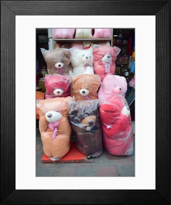 Framed Print : Different size and color teddy bears kept in front of a shop for sell Framed Print : Different size and color teddy bears kept in front of a shop for sell