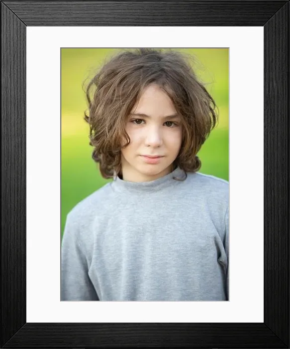 Framed Print : Handsome boy with long hair outdoors Framed Print : Handsome boy with long hair outdoors