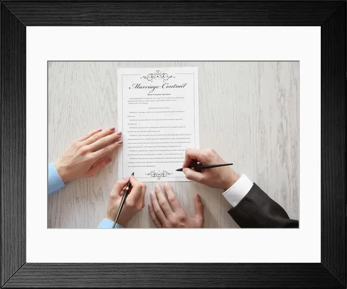 Framed Print : Couple signing marriage contract, closeup Framed Print : Couple signing marriage contract, closeup