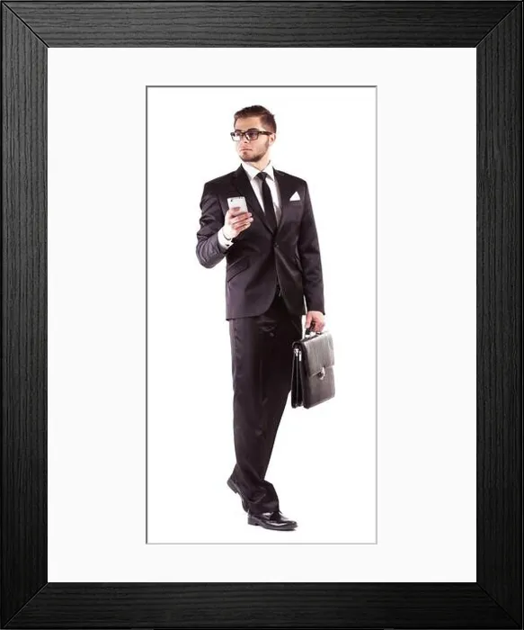 Framed Print : Elegant man in suit with mobile phone and briefcase isolated on white Framed Print : Elegant man in suit with mobile phone and briefcase isolated on white