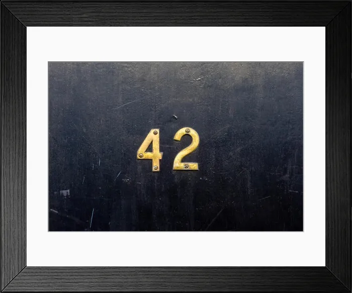 Framed Print : The answer is house number 42 with the forty two in bronze Framed Print : The answer is house number 42 with the forty two in bronze
