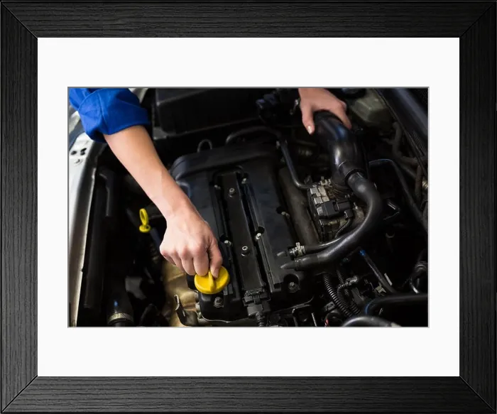Framed Print : Mechanic working under the hood Framed Print : Mechanic working under the hood