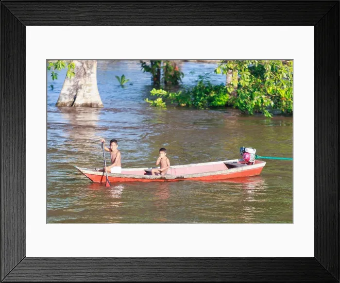 Framed Print : Young native children on the Amazon river during the wet season. 2 boys Framed Print : Young native children on the Amazon river during the wet season. 2 boys