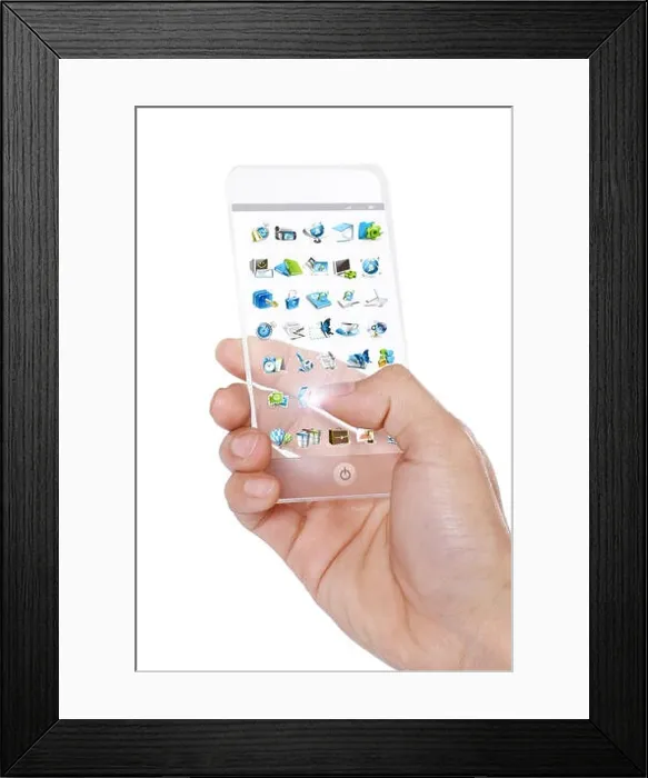 Framed Print : One hand holding a mobile phone model Framed Print : One hand holding a mobile phone model