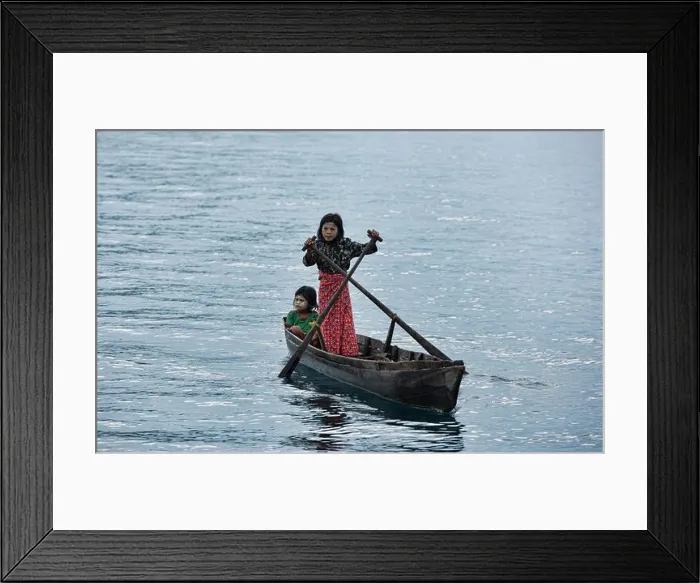 Framed Print : Moken girl rowing in the Mergui Archipelago, Myanmar Framed Print : Moken girl rowing in the Mergui Archipelago, Myanmar