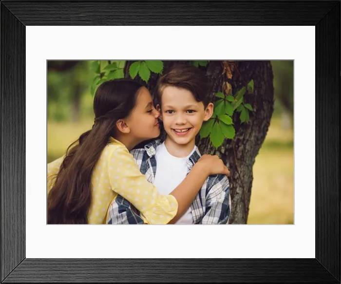 Framed Print : Little girl kissing boy Framed Print : Little girl kissing boy