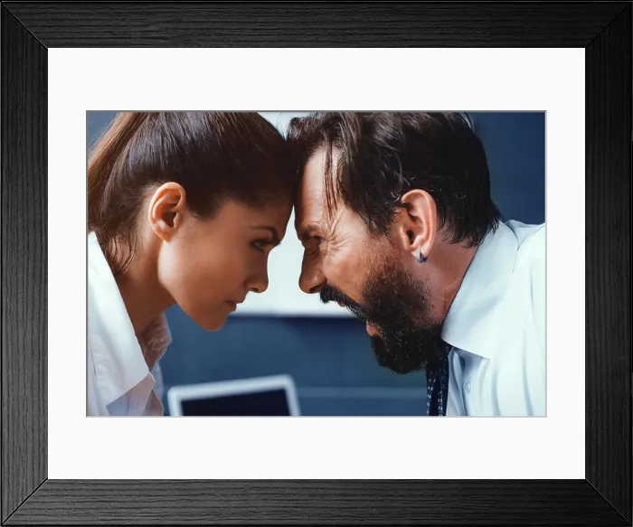 Framed Print : Young businessman and businesswoman compete Framed Print : Young businessman and businesswoman compete