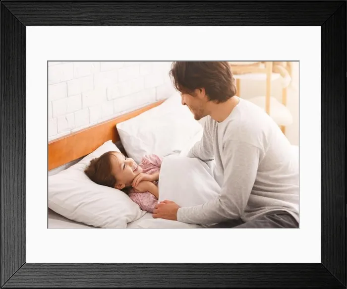 Framed Print : Little girl happy to see her dad in the morning Framed Print : Little girl happy to see her dad in the morning