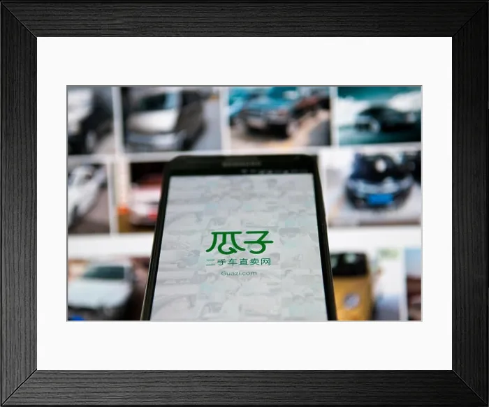 Framed Print : FILE--A Chinese mobile phone user uses the app of China's largest used-car trading platform Guazi Framed Print : FILE--A Chinese mobile phone user uses the app of China's largest used-car trading platform Guazi