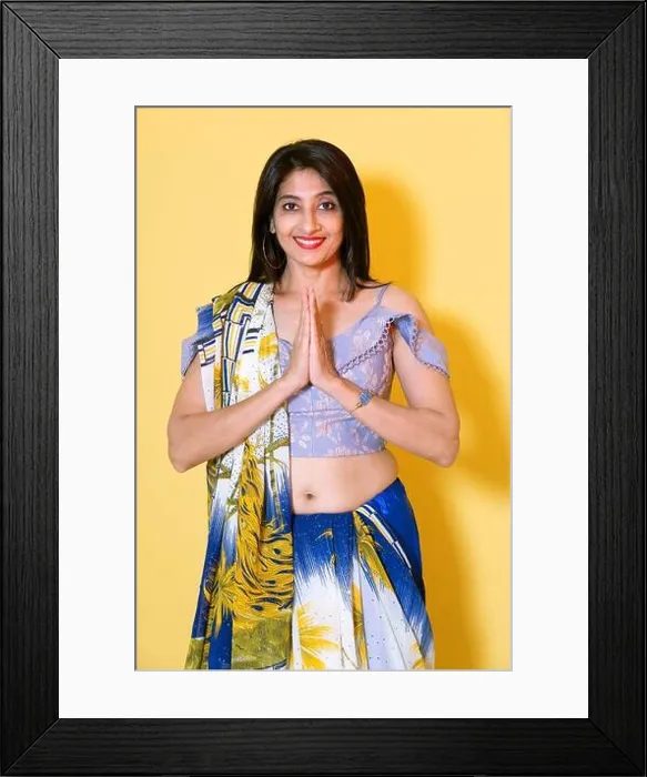 Framed Print : Young female model in traditional Saree attire. Hands in greeting gesture or Namaste Framed Print : Young female model in traditional Saree attire. Hands in greeting gesture or Namaste