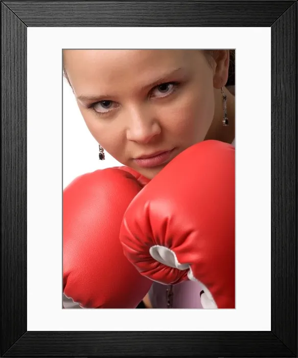 Framed Print : serious woman in red boxing gloves closeup Framed Print : serious woman in red boxing gloves closeup
