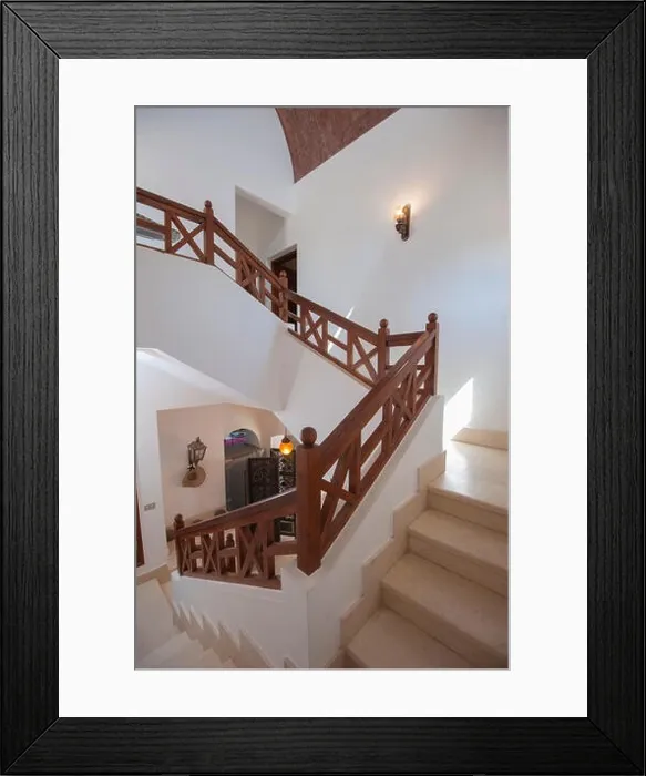 Framed Print : Marble curved staircase from ground floor to upstairs in luxury holiday villa with wooden bannister railing Framed Print : Marble curved staircase from ground floor to upstairs in luxury holiday villa with wooden bannister railing