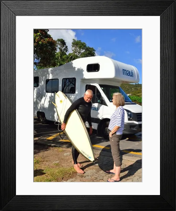 Framed Print : Surfer( male) talking to motorhomer (woman) on Hot Water Beach with the Maui Platinum Beach motorhome behind Framed Print : Surfer( male) talking to motorhomer (woman) on Hot Water Beach with the Maui Platinum Beach motorhome behind