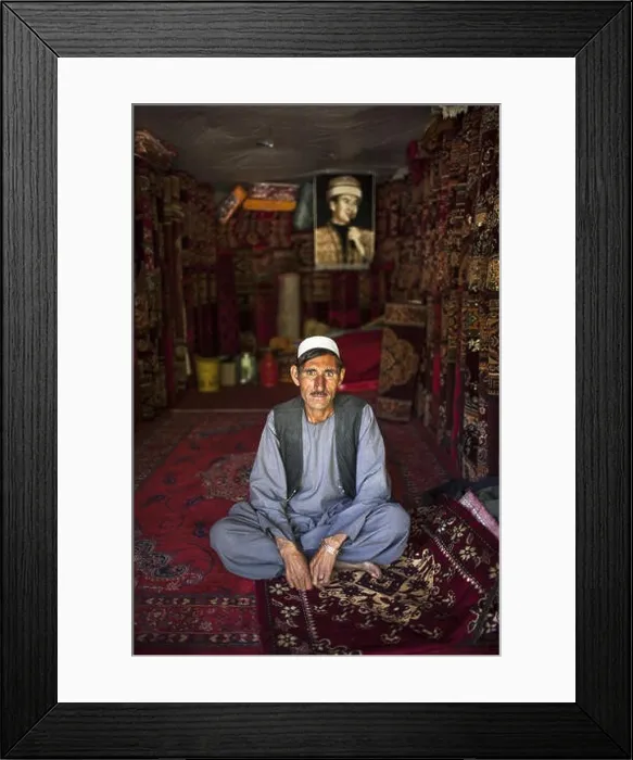 Framed Print : Ismaili Carpet seller with Aga Khan portrait carpet, in Ishkashim, Badakhshan, Afghanistan Framed Print : Ismaili Carpet seller with Aga Khan portrait carpet, in Ishkashim, Badakhshan, Afghanistan
