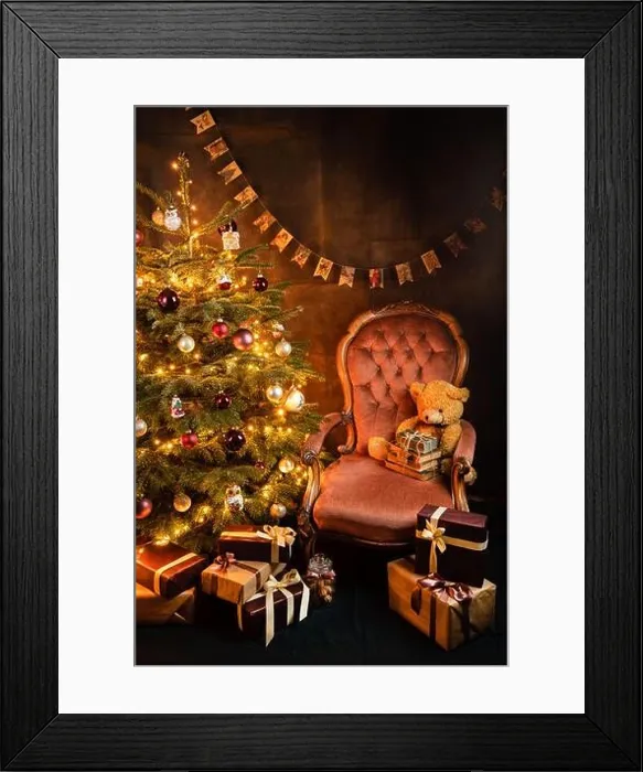 Framed Print : Christmas tree with decorations, vintage old armchair with toys and books, piles of presents, postcard concept Framed Print : Christmas tree with decorations, vintage old armchair with toys and books, piles of presents, postcard concept