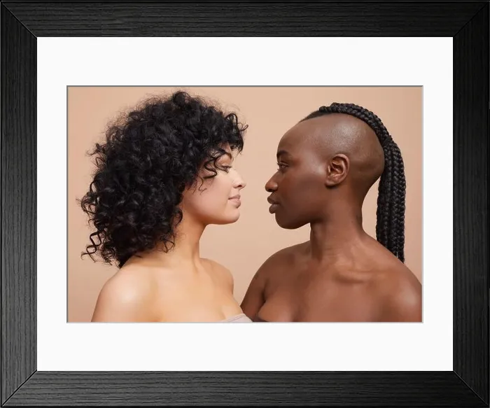 Framed Print : Studio portrait of beautiful women standing face to face Framed Print : Studio portrait of beautiful women standing face to face