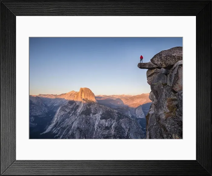 Framed Print : A male hiker standing on an overhanging rock at Glacier Point enjoying the breathtaking view towards famous Half Dome Framed Print : A male hiker standing on an overhanging rock at Glacier Point enjoying the breathtaking view towards famous Half Dome