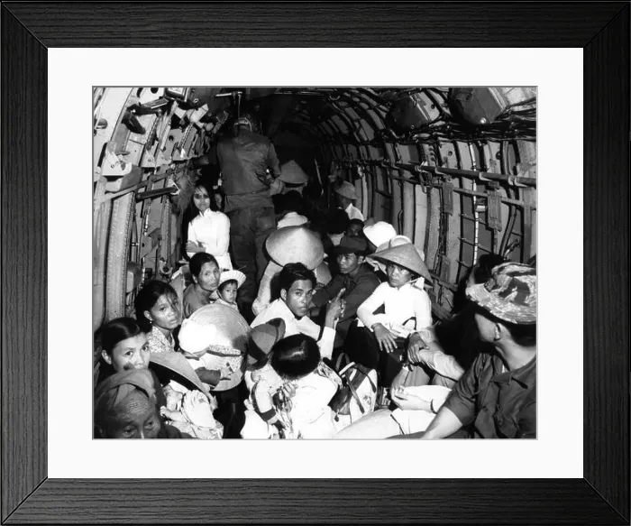Framed Print : Stunned by the viciousness of a Viet Cong attack on their village Framed Print : Stunned by the viciousness of a Viet Cong attack on their village