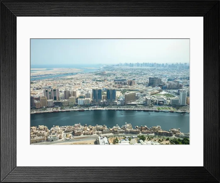Framed Print : Cityscape view of Deira and Old Dubai area behind man-made Dubai Canal. Dubai, UAE Framed Print : Cityscape view of Deira and Old Dubai area behind man-made Dubai Canal. Dubai, UAE
