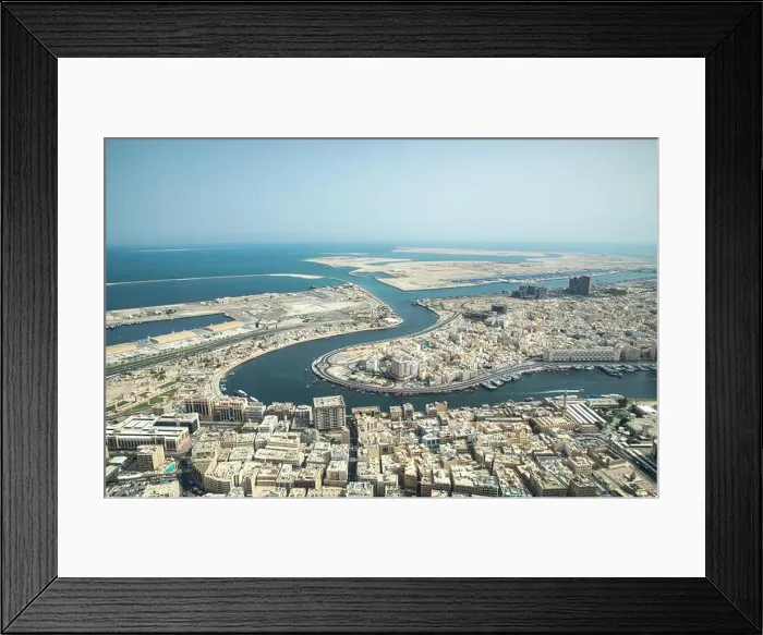 Framed Print : Cityscape view of Deira and Old Dubai area behind man-made Dubai Canal. Dubai, UAE Framed Print : Cityscape view of Deira and Old Dubai area behind man-made Dubai Canal. Dubai, UAE