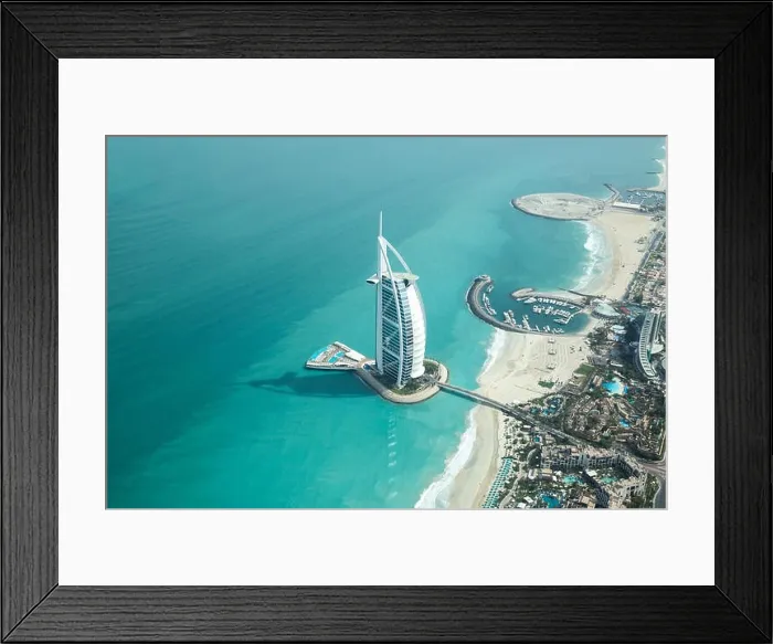 Framed Print : Dubai, UAE - May 18, 2018: Aerial view of Burj Al Arab luxury hotel on the coast of Persian Gulf on a clear sunny day Framed Print : Dubai, UAE - May 18, 2018: Aerial view of Burj Al Arab luxury hotel on the coast of Persian Gulf on a clear sunny day