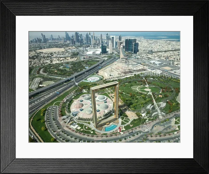 Framed Print : Dubai, UAE - May 18, 2018: Golden Dubai Frame viewed from above on a sunny day on the background of Dubai Downtown Framed Print : Dubai, UAE - May 18, 2018: Golden Dubai Frame viewed from above on a sunny day on the background of Dubai Downtown