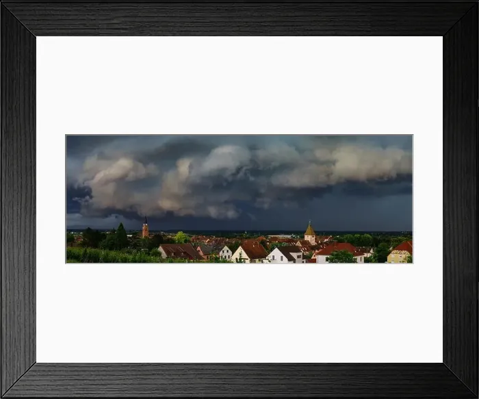 Framed Print : Dark sky, overcast, black clouds. Stormy weather over the village Bergheim. Panoramic view. Alsace, France Framed Print : Dark sky, overcast, black clouds. Stormy weather over the village Bergheim. Panoramic view. Alsace, France