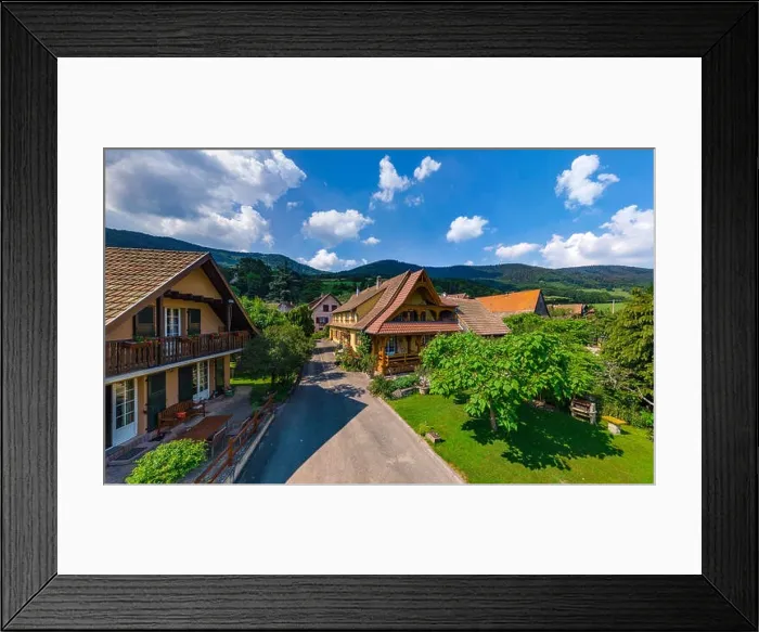 Framed Print : Old but renovated village house in countryside aerial view, Alsace, France Framed Print : Old but renovated village house in countryside aerial view, Alsace, France