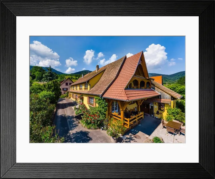 Framed Print : Old but renovated village house in countryside aerial view, Alsace, France Framed Print : Old but renovated village house in countryside aerial view, Alsace, France