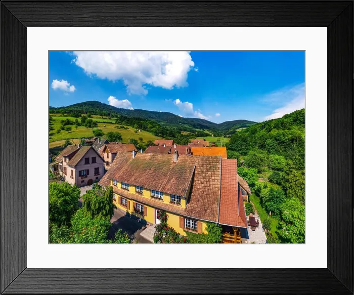Framed Print : Old but renovated village house in countryside aerial view, Alsace, France Framed Print : Old but renovated village house in countryside aerial view, Alsace, France