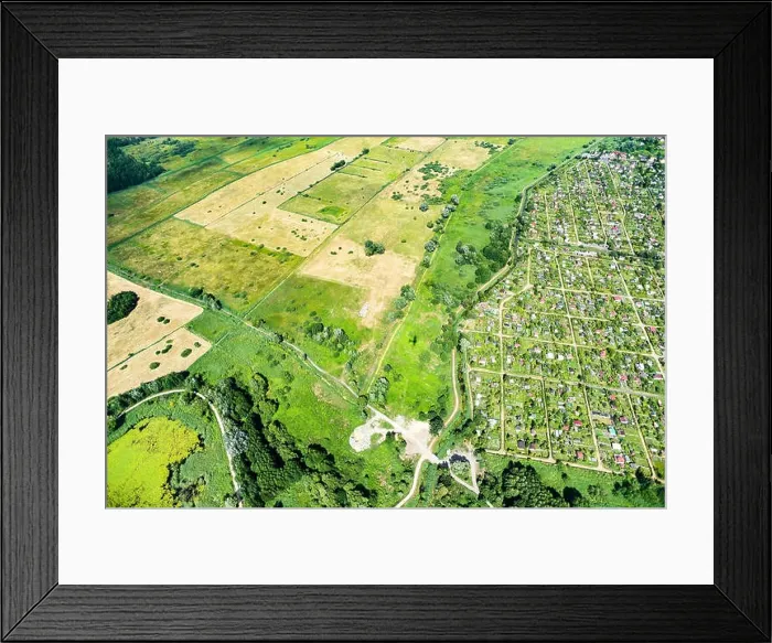 Framed Print : Panorama of green areas view from above. Meadows, pastures, farmland top view Framed Print : Panorama of green areas view from above. Meadows, pastures, farmland top view