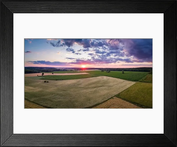 Framed Print : Beautiful summer fields landscape from drone. Sunset over fields and village Framed Print : Beautiful summer fields landscape from drone. Sunset over fields and village