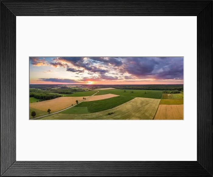 Framed Print : Beautiful summer fields landscape from drone. Sunset over fields and village Framed Print : Beautiful summer fields landscape from drone. Sunset over fields and village