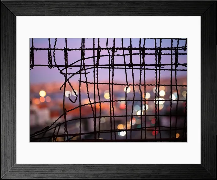 Framed Print : Blurry close up of Valparaiso during dusk through a wire fence Framed Print : Blurry close up of Valparaiso during dusk through a wire fence
